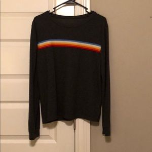 grey sweater with colorful stripes